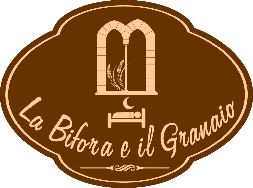 een bruine munt met een raam en de tekst la bitteneria het grijst bij La Bifora e il granaio in Sciacca