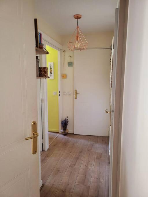 an empty room with a hallway with a door and a hallway at Une invitation à la détente in Nice