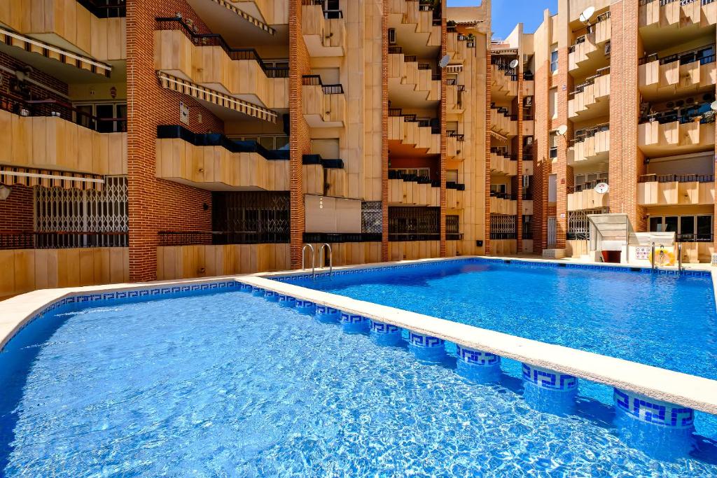 Bazén v ubytování Holiday Playa Jardin IV nebo v jeho okolí
