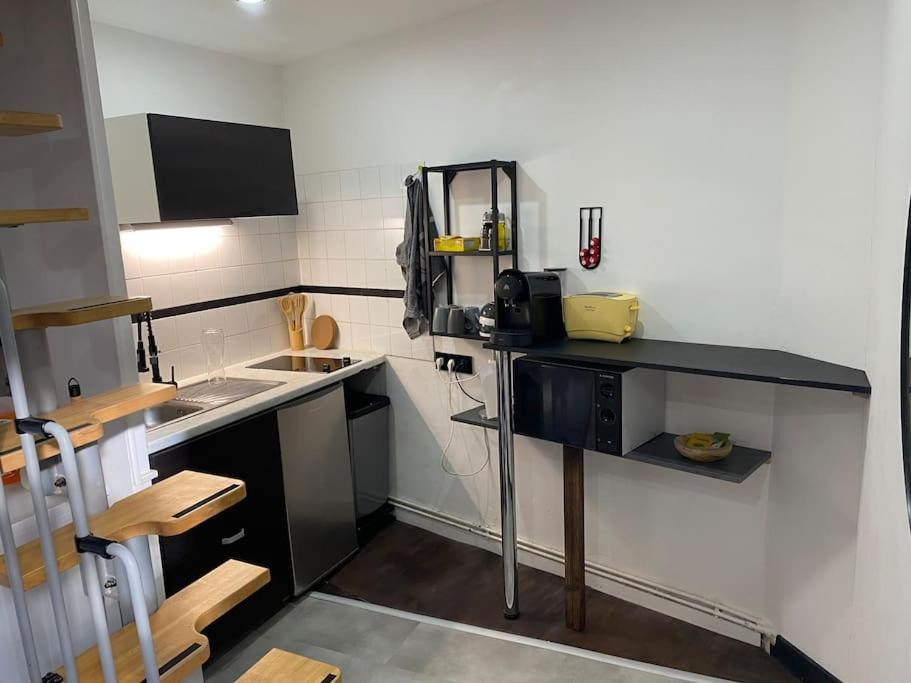 Kuchyň nebo kuchyňský kout v ubytování Petit duplex cocooning
