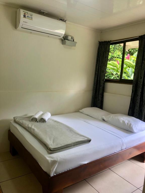 Postel nebo postele na pokoji v ubytování Le Petit Hotel