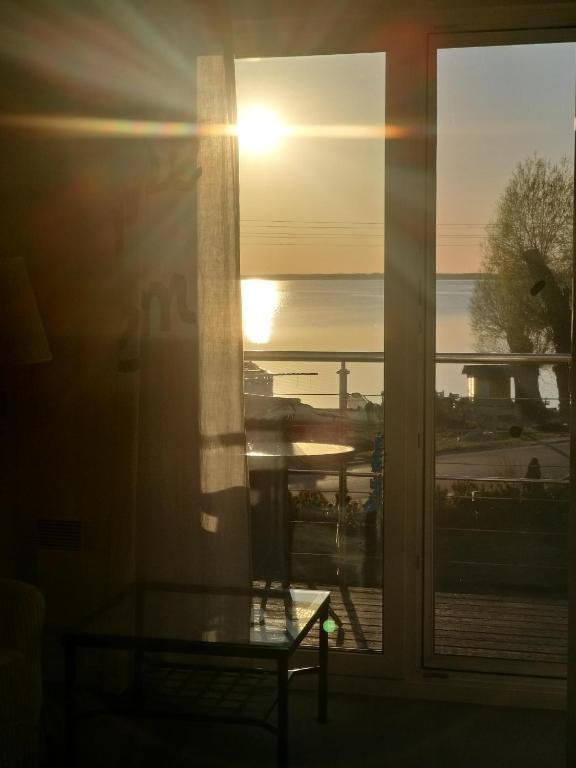 a view of the sunset from a window at Nowe Guty Fun in Nowe Guty