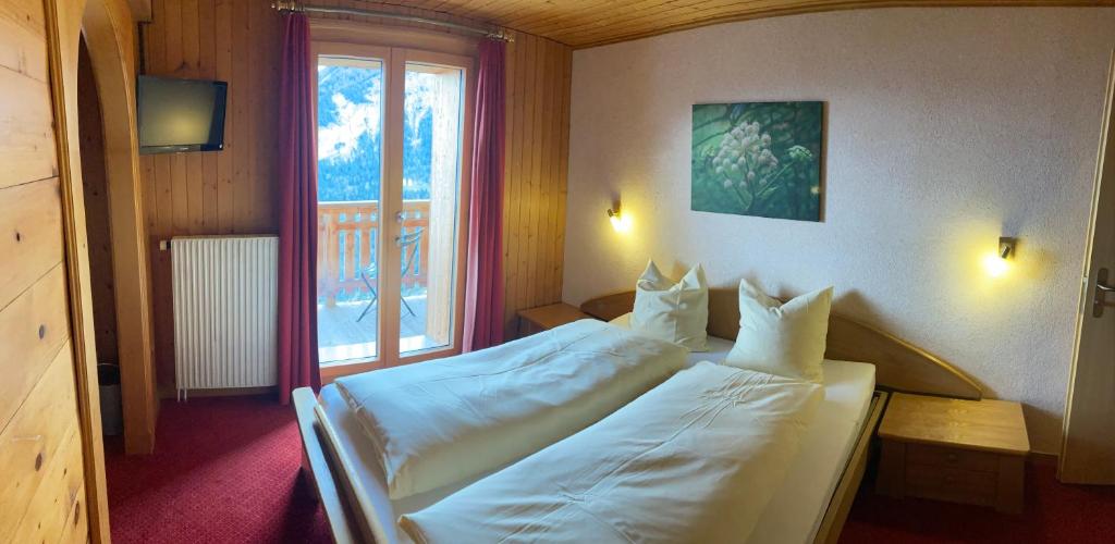 Postel nebo postele na pokoji v ubytování Haus Rhodania