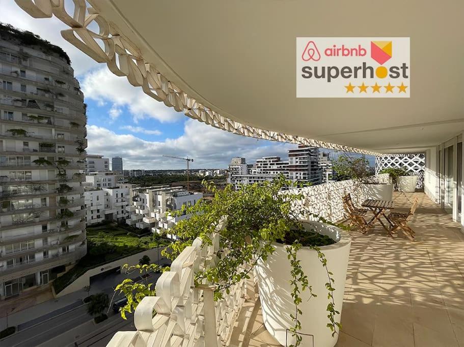 a balcony with a view of a city with buildings at Tour Végétale CFC Anfa Luxury in Casablanca