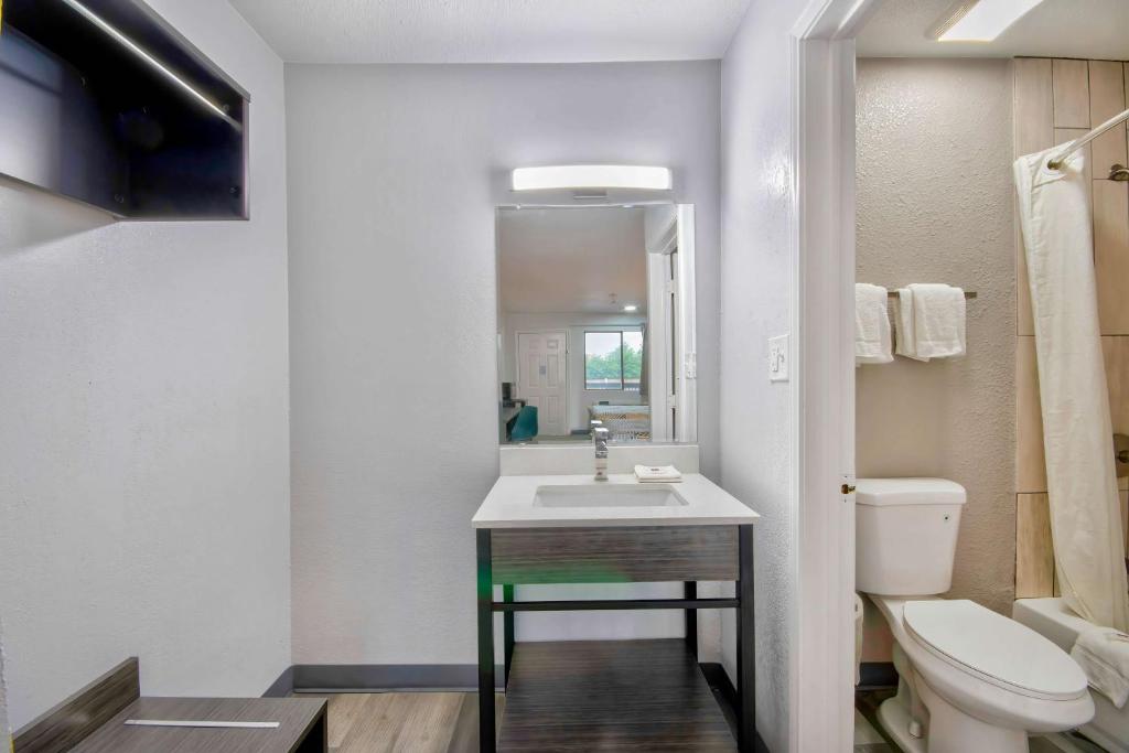 a bathroom with a sink and a toilet at Motel 6 Texarkana, TX in Texarkana