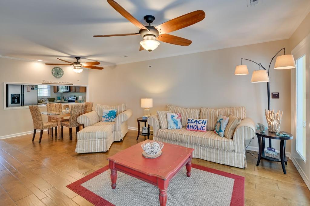 a living room with white furniture and a ceiling fan at Coastal Vacation Rental - 2 Mi to Huntington Beach in Myrtle Beach