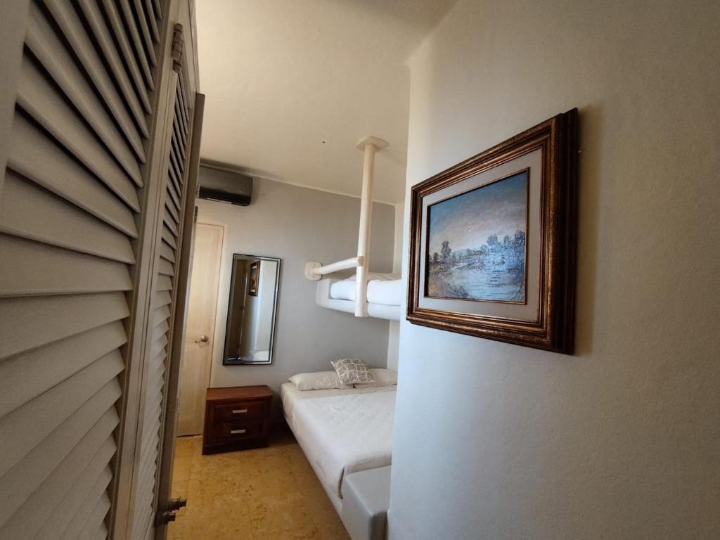 Postel nebo postele na pokoji v ubytování Ixtapa frente al mar
