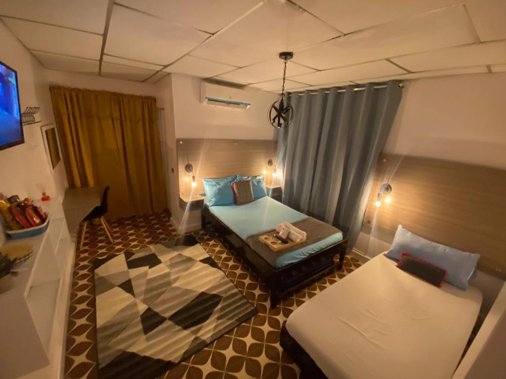 Cama o camas de una habitación en Hotel Tamaiti