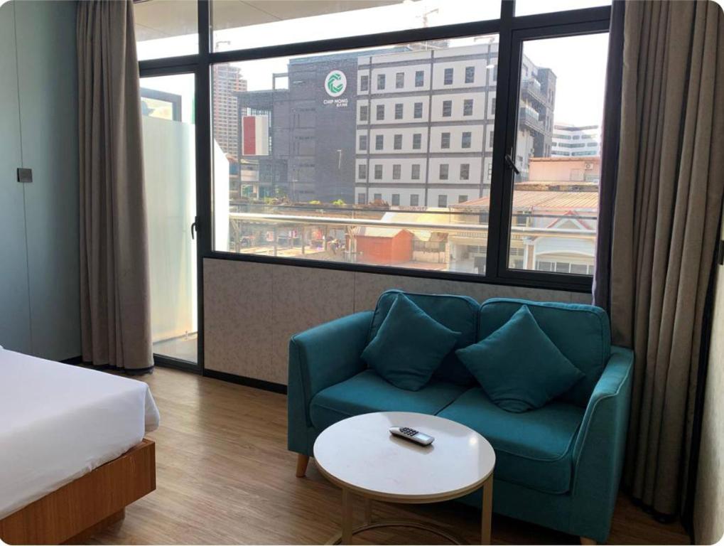 Postel nebo postele na pokoji v ubytování Joy Hotel