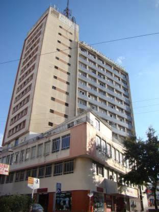 a tall white building with aiger at AP CENTRAL in Campina Grande