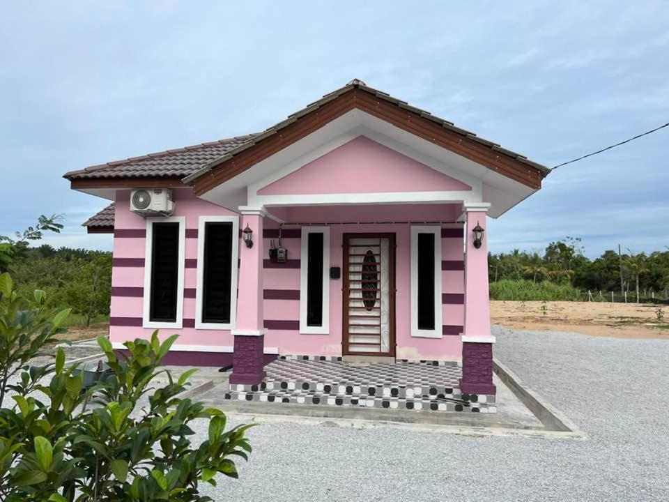 a small house is good enough for a small family of four at Homestay Armand Pengkalan Balak Melaka in Masjid Tanah