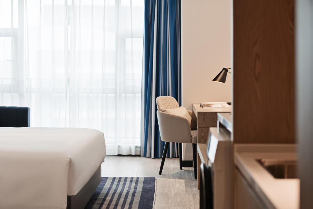 Postel nebo postele na pokoji v ubytování Livetour Hotel Luogang Science City Guangzhou