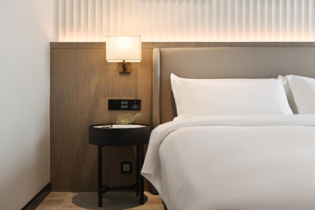 Postel nebo postele na pokoji v ubytování Livetour Hotel Luogang Science City Guangzhou