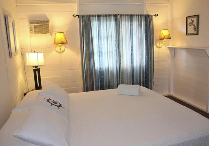 Postel nebo postele na pokoji v ubytování Hostal Corotu