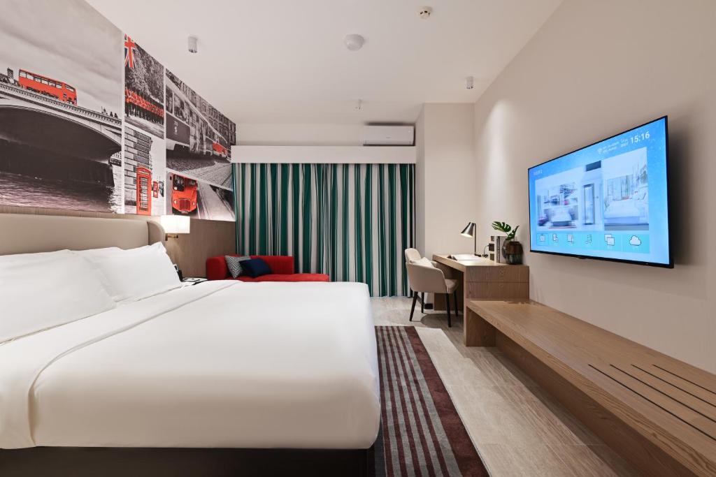 Postel nebo postele na pokoji v ubytování Livetour Hotel Luogang Science City Guangzhou