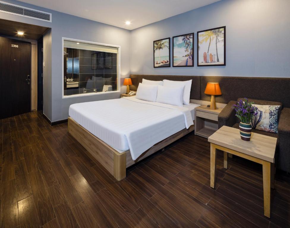 Postel nebo postele na pokoji v ubytování DB Hotel Nha Trang