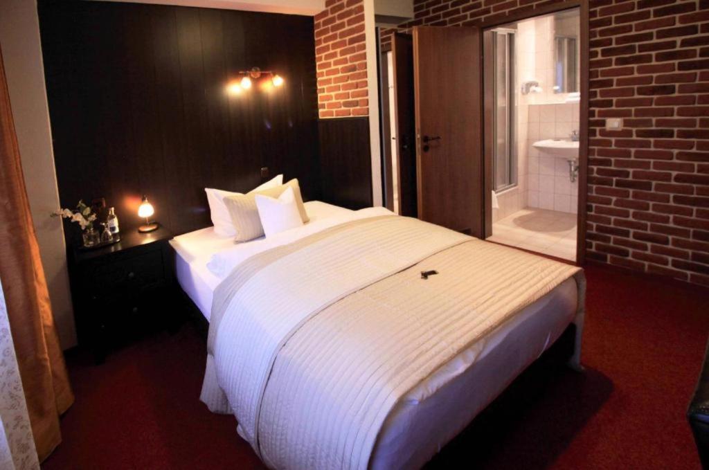 Voodi või voodid majutusasutuse Hotel "Am Fischhof" toas