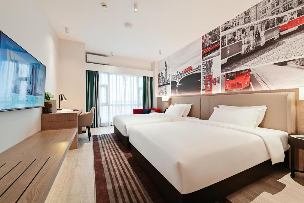 Postel nebo postele na pokoji v ubytování Livetour Hotel Luogang Science City Guangzhou