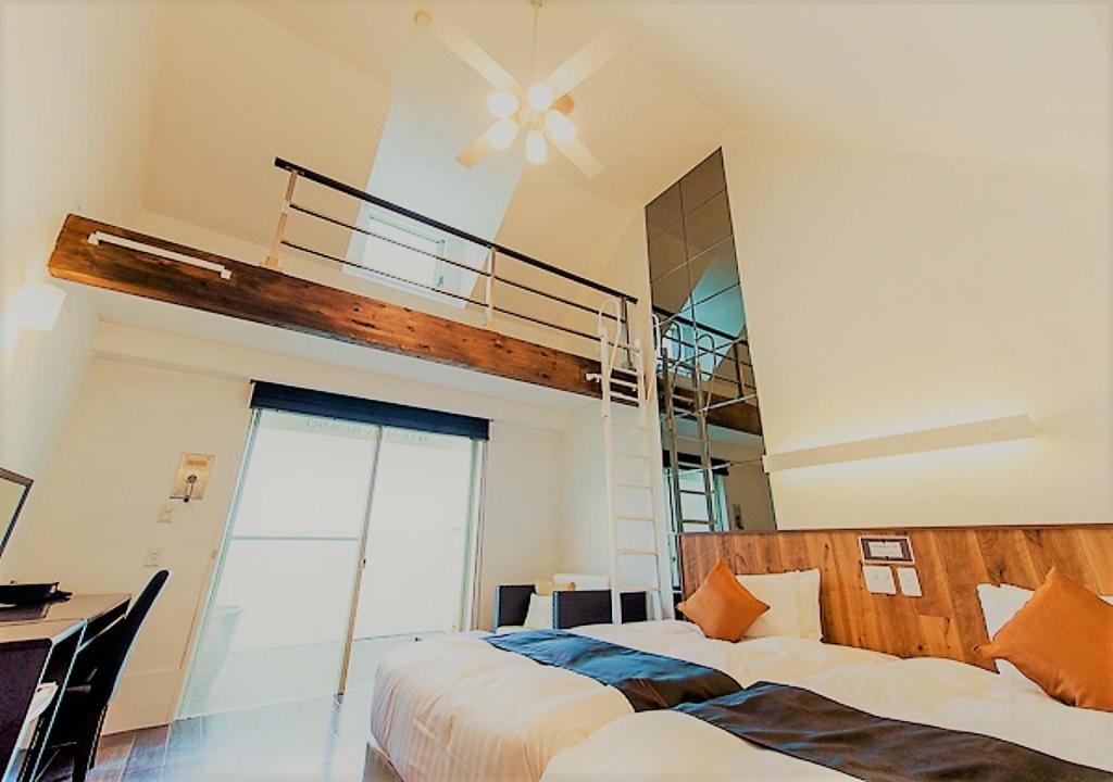 Postel nebo postele na pokoji v ubytování LiVEMAX RESORT Izu Shimoda