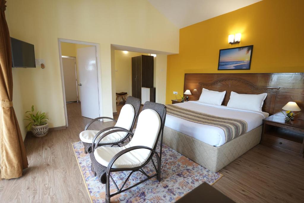 Postel nebo postele na pokoji v ubytování Indismart Woodbourne Resort