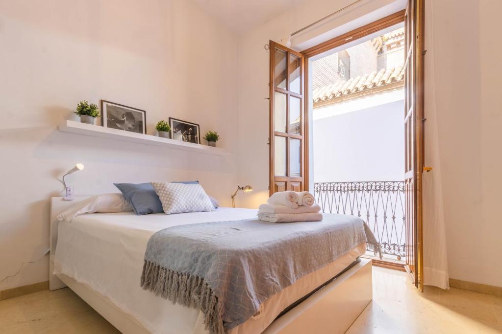 Posteľ alebo postele v izbe v ubytovaní Apartamento Anais Centro Sevilla