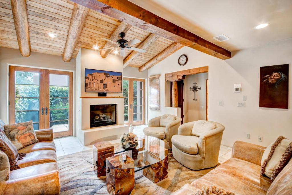 a living room with a couch and chairs and a fireplace at El Corazon de Santa Fe, 3 Bedrooms, Sleeps 6, Flat Panel TVs, Fireplaces in Santa Fe