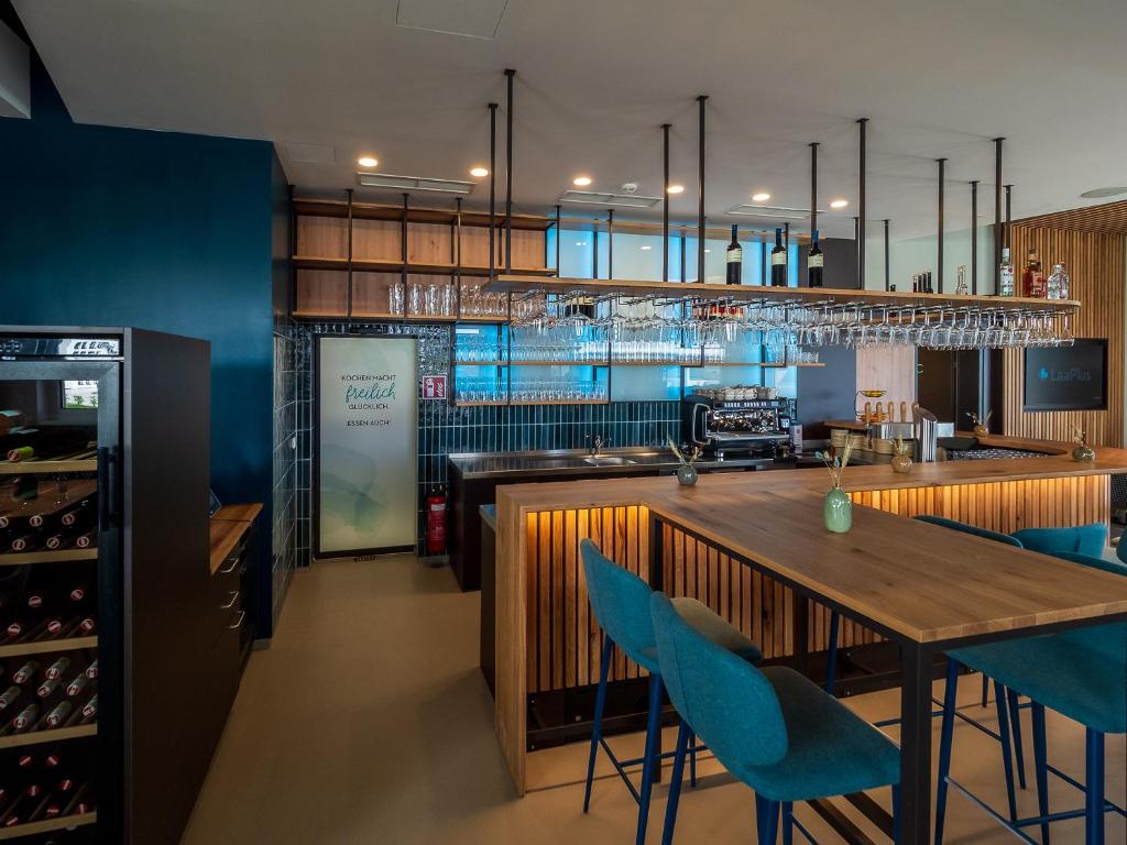 Kuchyň nebo kuchyňský kout v ubytování freilich. Bistro. Bar. Hotel - digitaler self check in