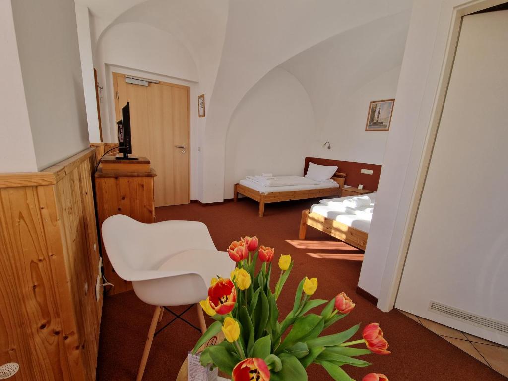 Postel nebo postele na pokoji v ubytování Garni Hotel Zum Hothertor