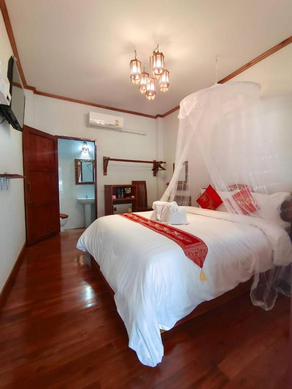 Postel nebo postele na pokoji v ubytování Aphilapa Residence