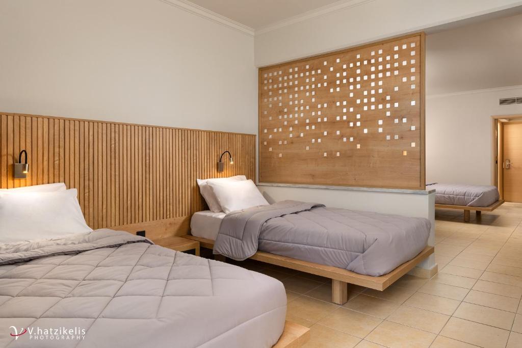 Postel nebo postele na pokoji v ubytování Kresten Palace Hotel