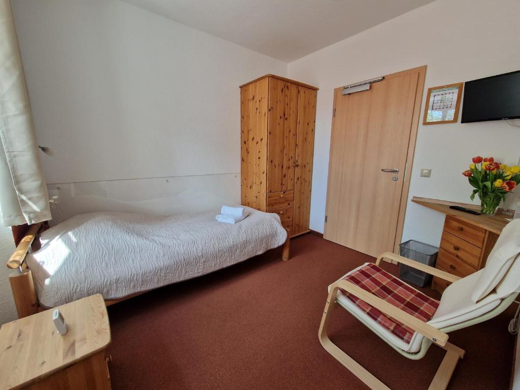 Postel nebo postele na pokoji v ubytování Garni Hotel Zum Hothertor