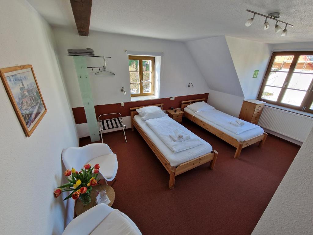 Postel nebo postele na pokoji v ubytování Garni Hotel Zum Hothertor