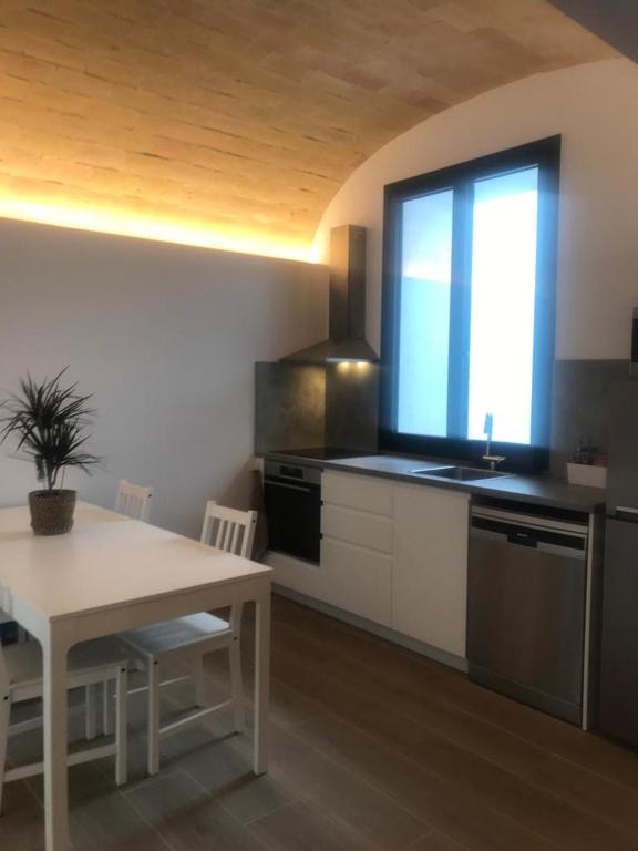 Kuchyň nebo kuchyňský kout v ubytování Encantadora casa rural Can Vidal
