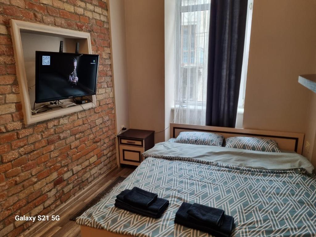Ein Bett oder Betten in einem Zimmer der Unterkunft MINI