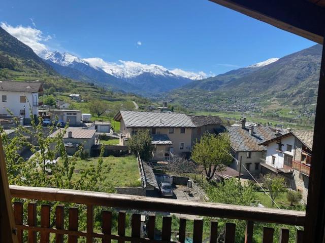a view from a balcony of a town with mountains at Casa OLMA in Aosta