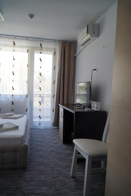Postel nebo postele na pokoji v ubytování Hotel & MedSpa Siret