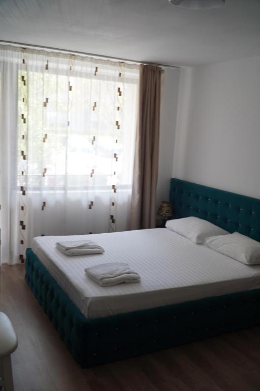 Postel nebo postele na pokoji v ubytování Hotel & MedSpa Siret