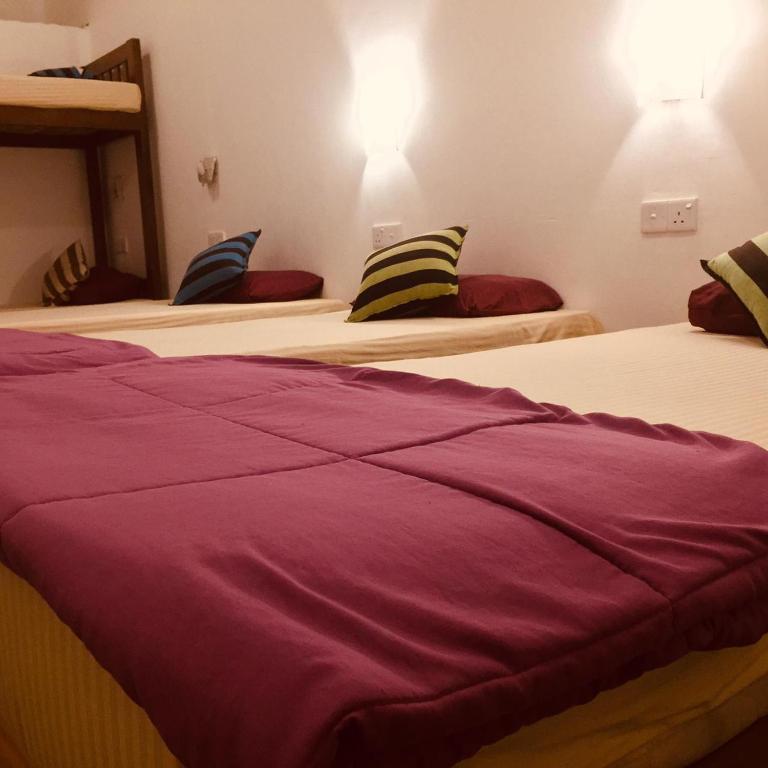 Postel nebo postele na pokoji v ubytování Tiki bar hostel ella
