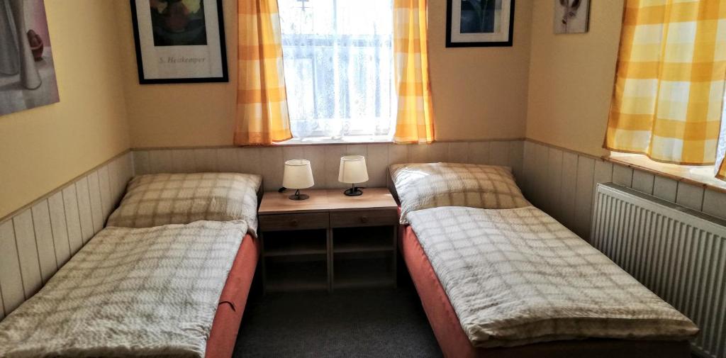 Postel nebo postele na pokoji v ubytování penzion U Soudu