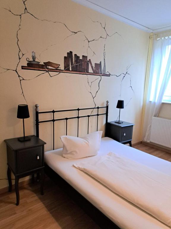 Postel nebo postele na pokoji v ubytování Gästehaus Villa Seraphinum