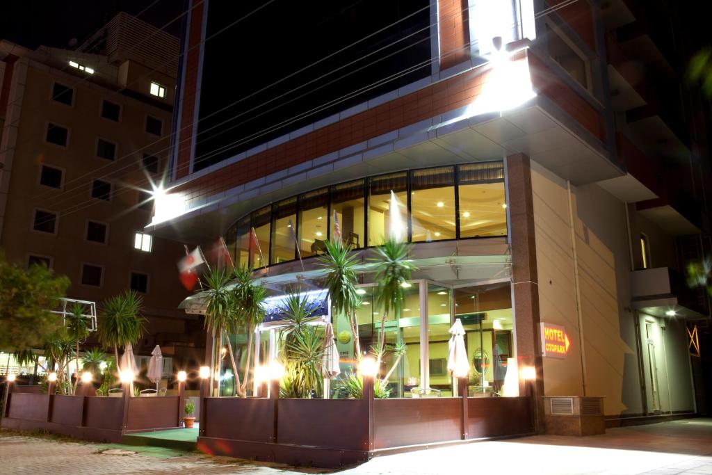 a building with palm trees outside of it at night at Sefa Hotel 2 Çorlu in Çorlu