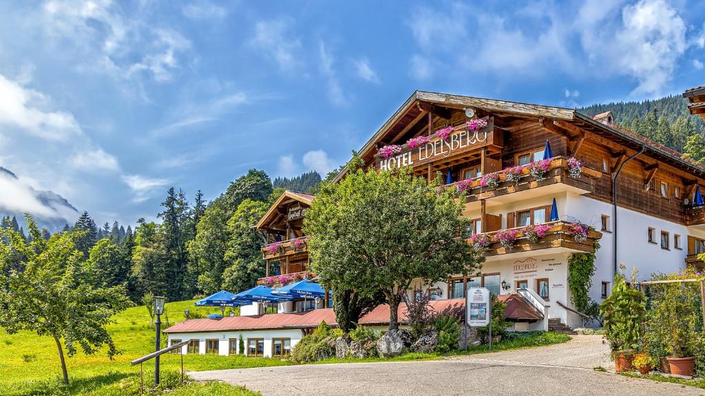 a building with balconies on the side of it at Berg- und Aktivhotel Edelsberg GmbH in Bad Hindelang