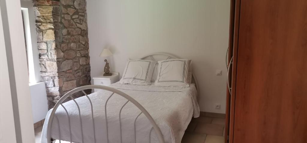 Postel nebo postele na pokoji v ubytování Chambre d'Hôtes Au Jardin Des Saveurs