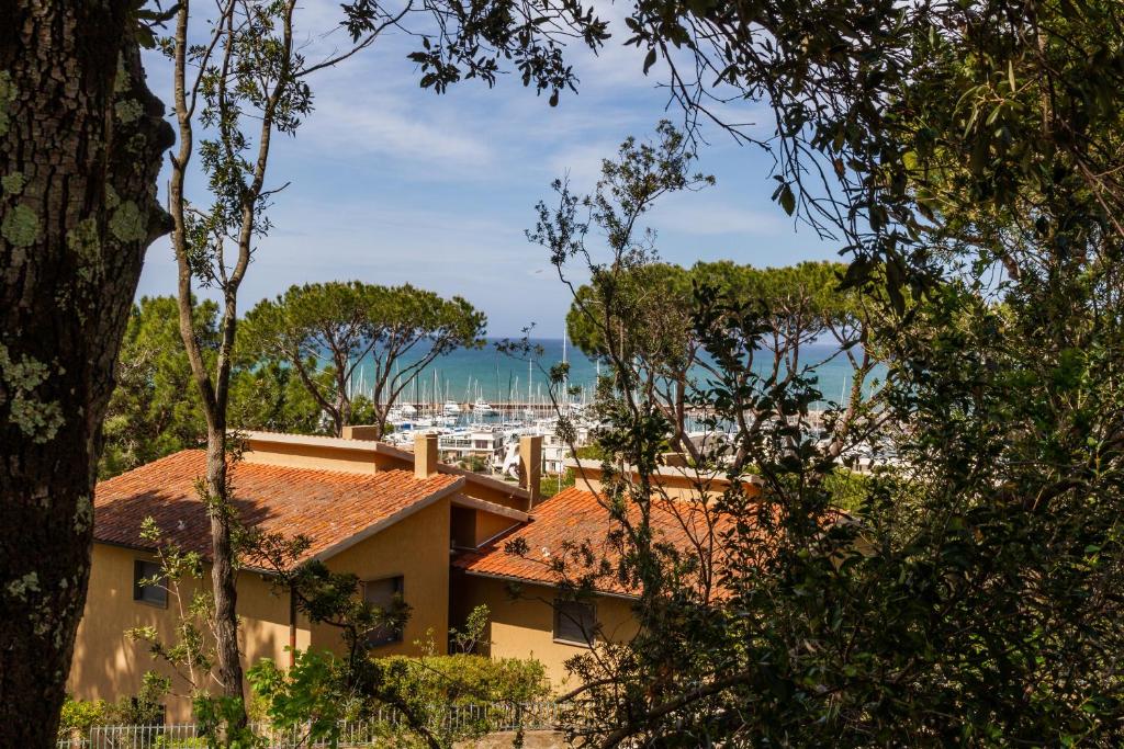a house with a view of a city at Villetta dei Pini in Scarlino