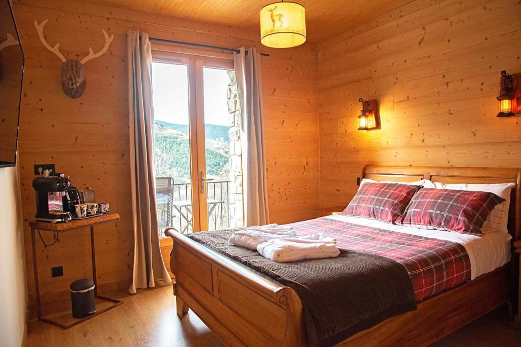 Postel nebo postele na pokoji v ubytování La Masia Del Taulat Chambres d´Hôtes
