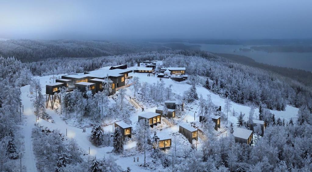 an aerial view of a house in the snow at Panorama Landscape Hotel in Nilsiä