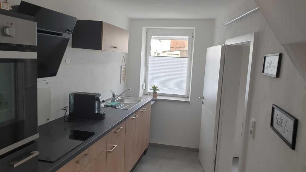 Kuchyň nebo kuchyňský kout v ubytování Ferienhaus Im Gäßchen