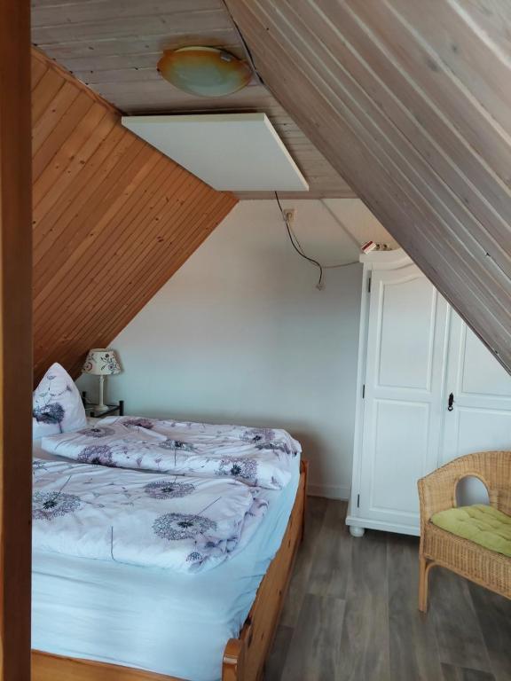 Postel nebo postele na pokoji v ubytování Pension zum Meer