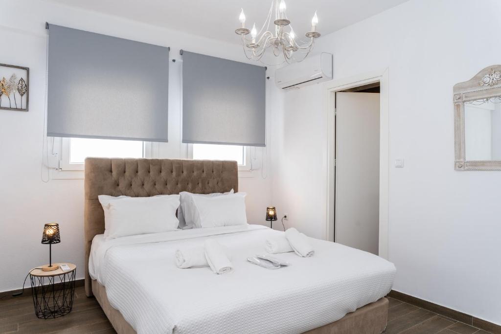 Postel nebo postele na pokoji v ubytování Thalassa & Thalassa Prive Residential Complex
