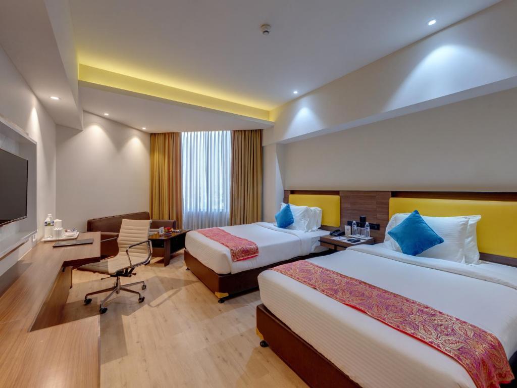 Postel nebo postele na pokoji v ubytování Amarpreet, Chhatrapati Sambhajinagar - AM Hotel Kollection